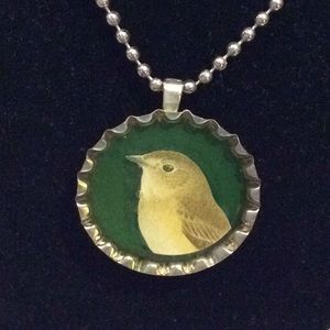 Handmade necklace with recycled bottle cap art.